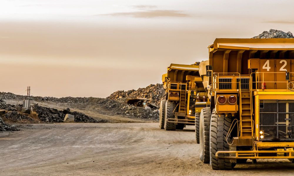 Maintenance technician performing preventive inspection on crusher equipment