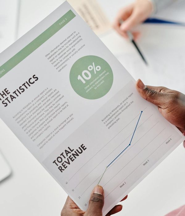 Satisfied mining company executives reviewing equipment performance reports